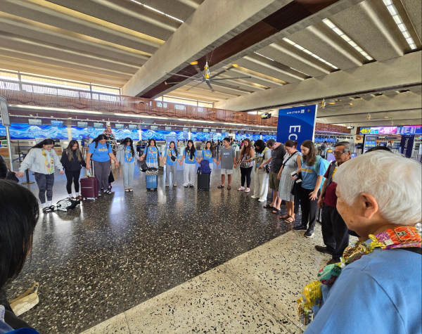 The group at Sacred Hearts Academy prays together before they leave for the Philippines. They spent two weeks volunteering, as part of a mission trip for the school. Photo courtesy of Sacred Hearts Academy.  
